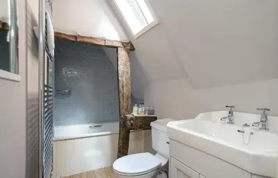 a bathroom with a toilet and a sink at The Cross Keys, Aldeburgh in Aldeburgh