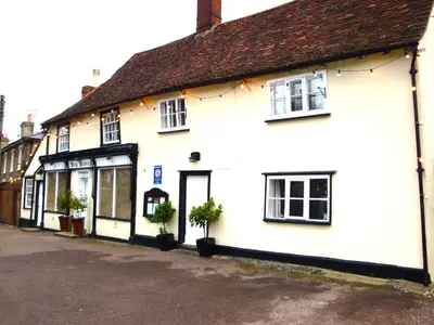 a white building on a street at Ship Stores B&B in Clare
