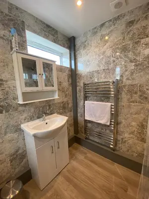 a bathroom with a sink and a window at Eclipse Apartment No 1 in Newmarket