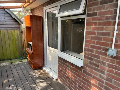 a brick house with a door and a window at Seaside resort in Felixstowe