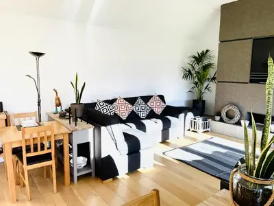 a living room with a couch and a table at The Thorpe Guesthouse in Huntingdon