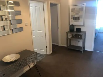a living room with a couch and a table at Market Hill Apartments in Royston