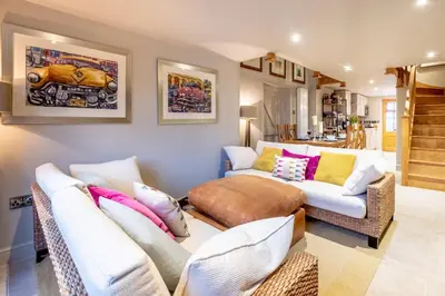 a living room with two chairs and a couch at Church Farm Lodge in Aldeburgh