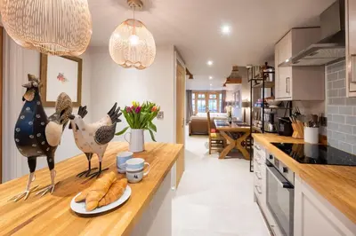 a kitchen with a counter with chickens on it at Church Farm Lodge in Aldeburgh