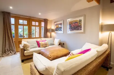 a living room with two chairs and a couch at Church Farm Lodge in Aldeburgh