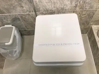 a white toilet in a bathroom with a sign on it at Old Thatch Bambers Green in Takeley