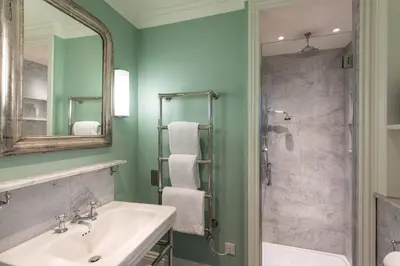 a bathroom with a sink and a shower at Roslin Beach Hotel in Southend-on-Sea