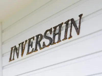 a sign with the word museum on a ceiling at Invershin -Aldeburgh Coastal Cottages in Thorpeness