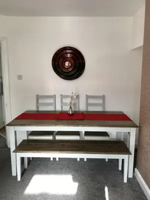 a table with a red cloth on top of it at The Avenues in Chelmsford