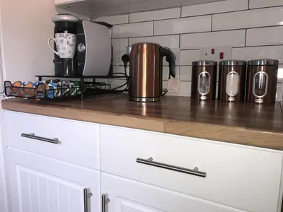 a counter top with pots and pans on it at The Avenues in Chelmsford