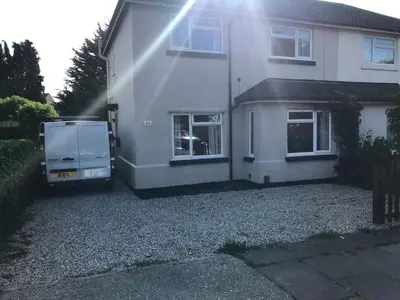 a house with a van parked in front of it at The Avenues in Chelmsford