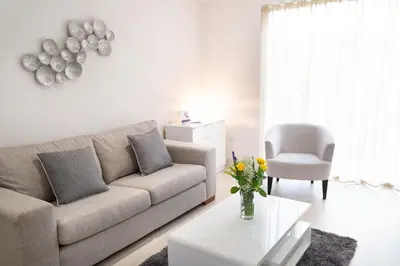 a living room with a couch and a table at Citystay Living - Park House in Cambridge