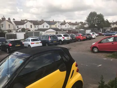 a bunch of cars parked in a parking lot at The Moorings B&B in Southend-on-Sea