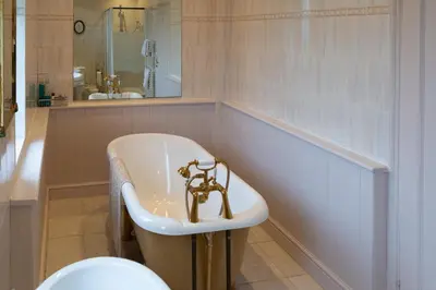 a bathroom with a sink and a toilet at Elmcroft Guest House in Epping
