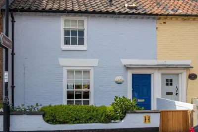 a blue house with a blue door at Little Tern Cottage in Aldeburgh