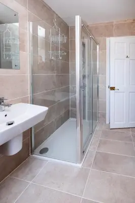 a bathroom with a shower and a sink at Rowan - Three Tuns Apartments , Wickham Market - by Aldeburgh Coastal Cottages in Pettistree