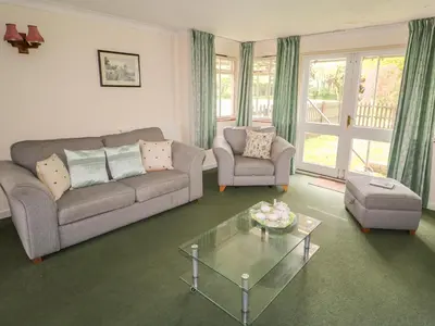 a living room with a couch and a coffee table at The Bothy in Eye