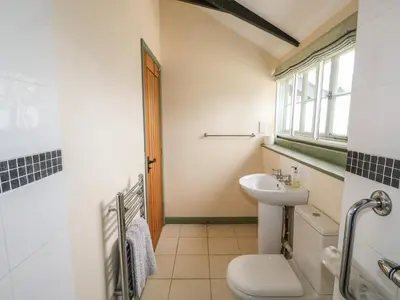 a bathroom with a sink and a toilet at The Bull Pen in Eye