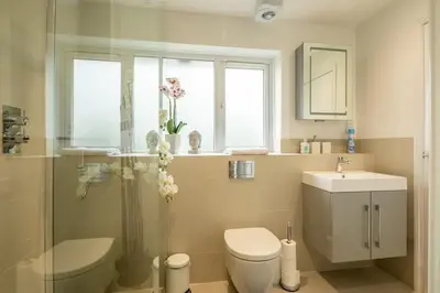a bathroom with a toilet and a sink at Delightful CENTRAL Duplex - 2 Mins To Station in Cambridge