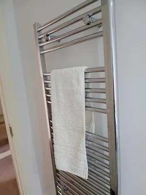 a towel hanging on a towel rack in a closet at Luxury 2-Bed Flat Central Ipswich Parking in Ipswich