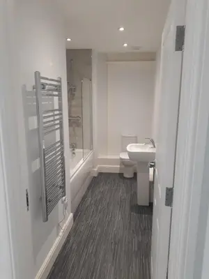 a bathroom with a shower and a toilet and a sink at Luxury 2-Bed Flat Central Ipswich Parking in Ipswich