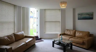 a living room with a couch and a coffee table at Luxury 2-Bed Flat Central Ipswich Parking in Ipswich