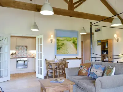 a living room with a couch and a table at The Studio-Uk11822 in Westleton