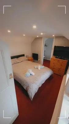 a bedroom with a bed with two towels on it at The Horse and Groom Guest House in Swaffham