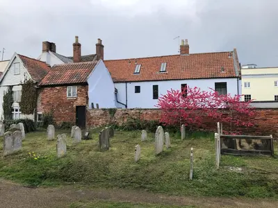 a group of graves in front of a building at Church View Bungay in Bungay