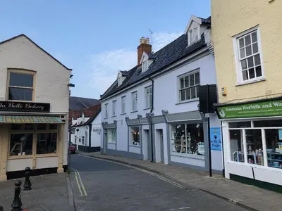 an empty street in a town with buildings at Church View Bungay in Bungay