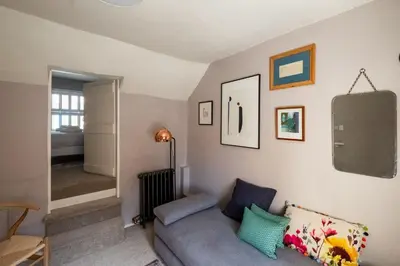 a living room with a couch in a room at Bloom Cottage in Aldeburgh