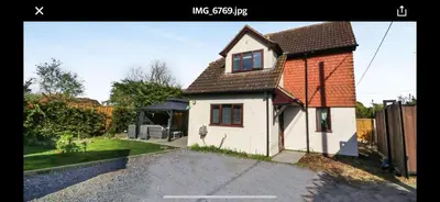 a small white house with a red roof at Pet Friendly Home in Chelmsford-Hot Tub-Sleeps 6 in Latchingdon and Snoreham