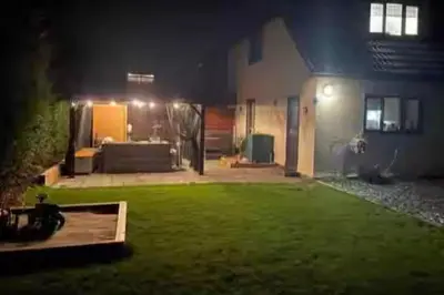 a house lit up at night with a lawn sidx sidx sidx sidx at Pet Friendly Home in Chelmsford-Hot Tub-Sleeps 6 in Latchingdon and Snoreham