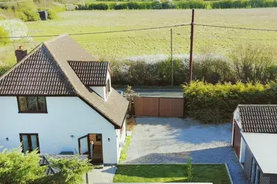 an aerial view of a white house with a fence at Pet Friendly Home in Chelmsford-Hot Tub-Sleeps 6 in Latchingdon and Snoreham