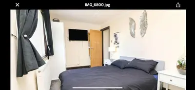 a bedroom with a bed and a television in it at Pet Friendly Home in Chelmsford-Hot Tub-Sleeps 6 in Latchingdon and Snoreham