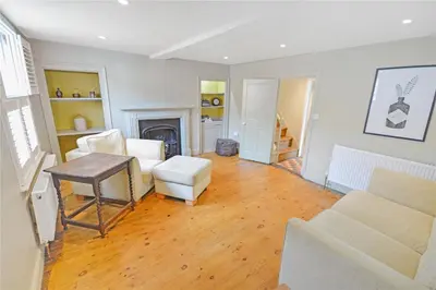 a living room with a table and chairs at Best located and beautifully renovated cottage in Diss