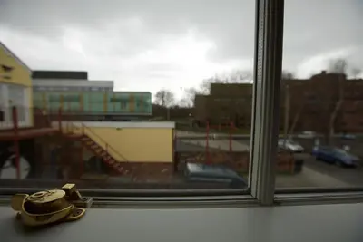 a toy car sitting on a window sill at Spacious Apartment with Roof Terrace, near The Waterfront, Ipswich in Ipswich