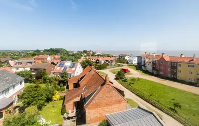 an aerial view of a small town with buildings at The Tower in Thorpeness
