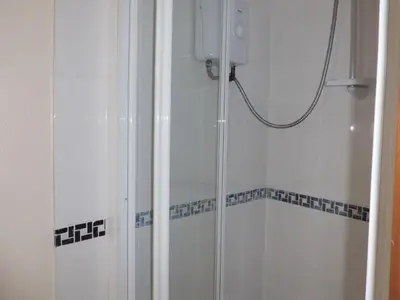 a shower with a glass door in a bathroom at The Elms in East Harling