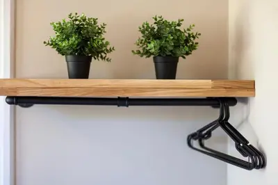 a wooden shelf with two potted plants on it at Pass the Keys Charming and Central Garden Studio Flat Free Parking in Cambridge