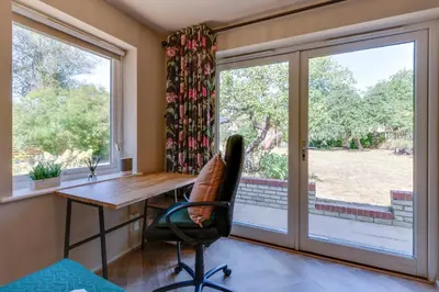 a home office with a desk and a window at Pass the Keys Charming and Central Garden Studio Flat Free Parking in Cambridge