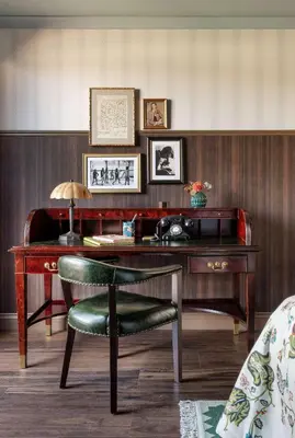 an office with a wooden desk with a green chair at Graduate by Hilton Cambridge in Cambridge