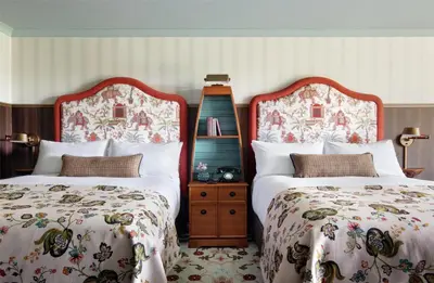 two beds sitting next to each other in a bedroom at Graduate by Hilton Cambridge in Cambridge