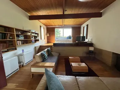 a living room with a couch and a table at Wood Place in Diss