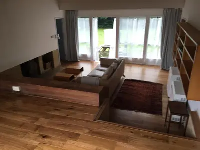 a living room with a couch and a fireplace at Wood Place in Diss