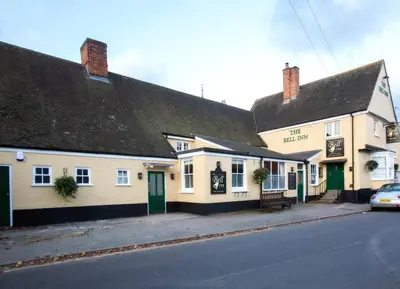 a row of buildings on the side of a street at The Bell Inn in Thorpe le Soken
