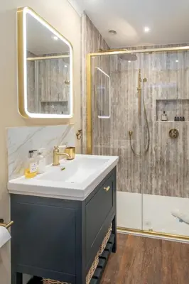 a bathroom with a sink and a shower at 69 Saxmundham Road in Aldeburgh