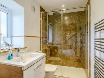 a bathroom with a sink and a shower at Blackwell Barn in Raydon