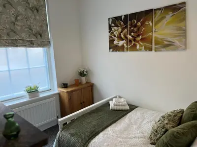 a bedroom with a bed and a window at Toothbrush Apartments - Central Ipswich - Fore St in Ipswich