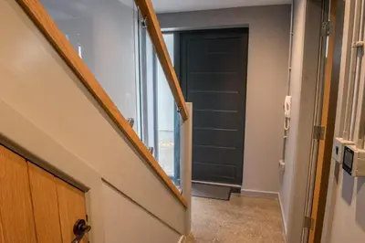 a hallway with a door leading into a room at Toothbrush Apartments - Central Ipswich - Fore St in Ipswich